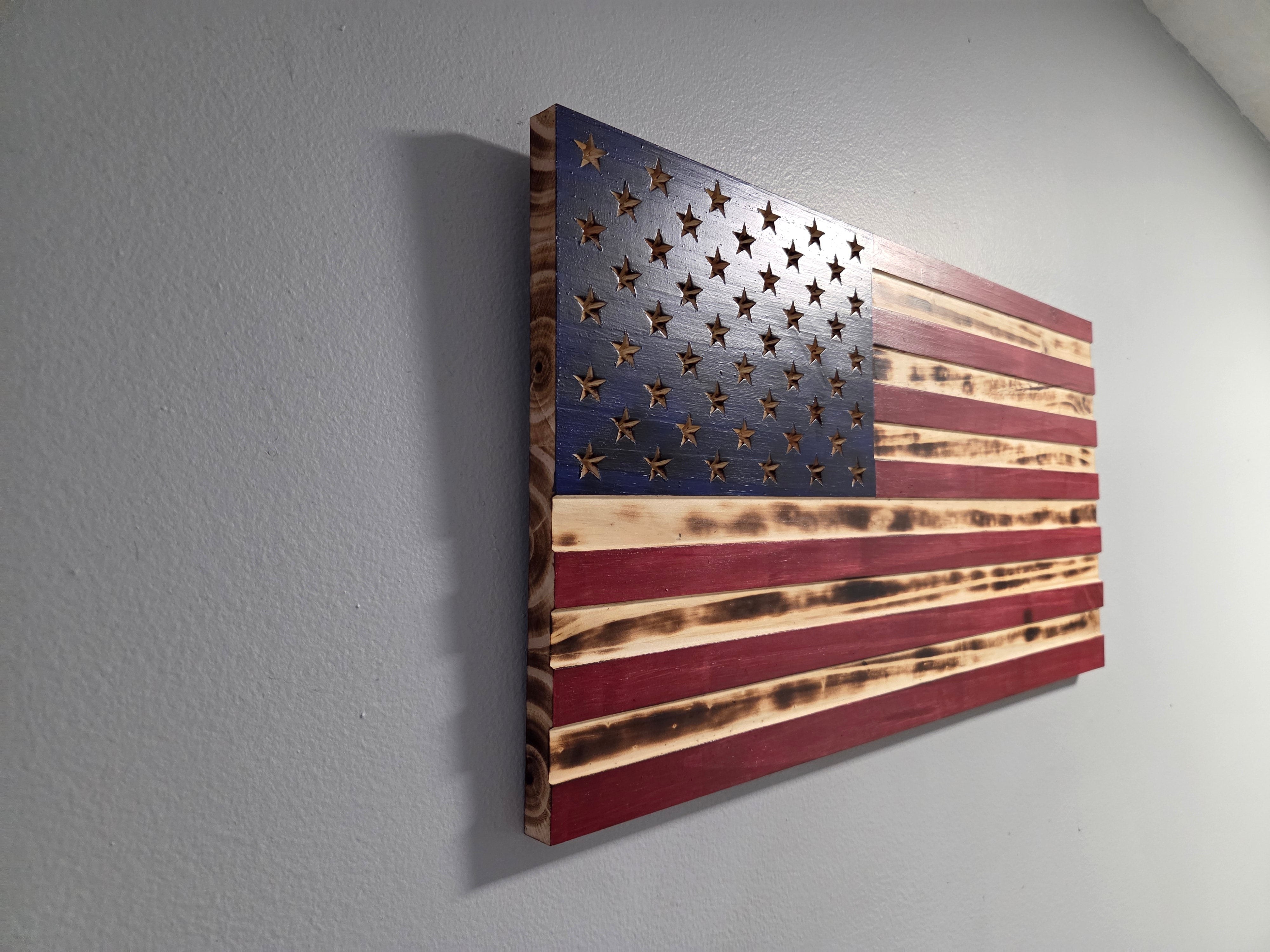 Close view of the carved detail on a wooden American flag