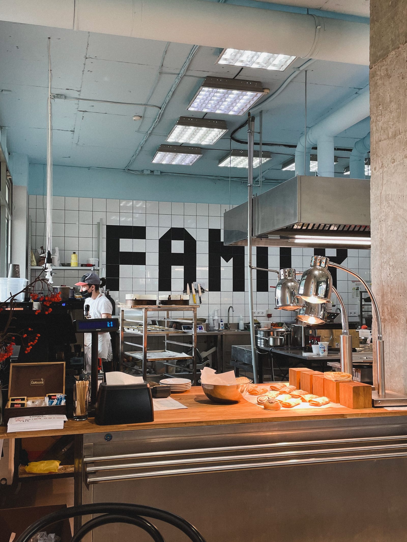 Stainless-steel equipment in a working commercial bakery kitchen