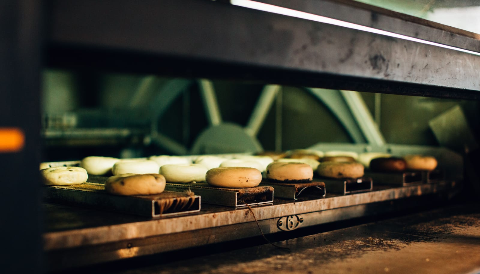Bagels baking inside a commercial oven