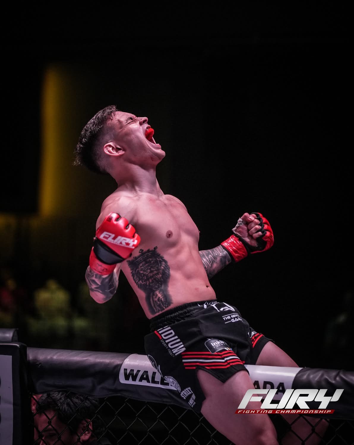 Micah White celebrating inside the cage after a mixed martial arts fight