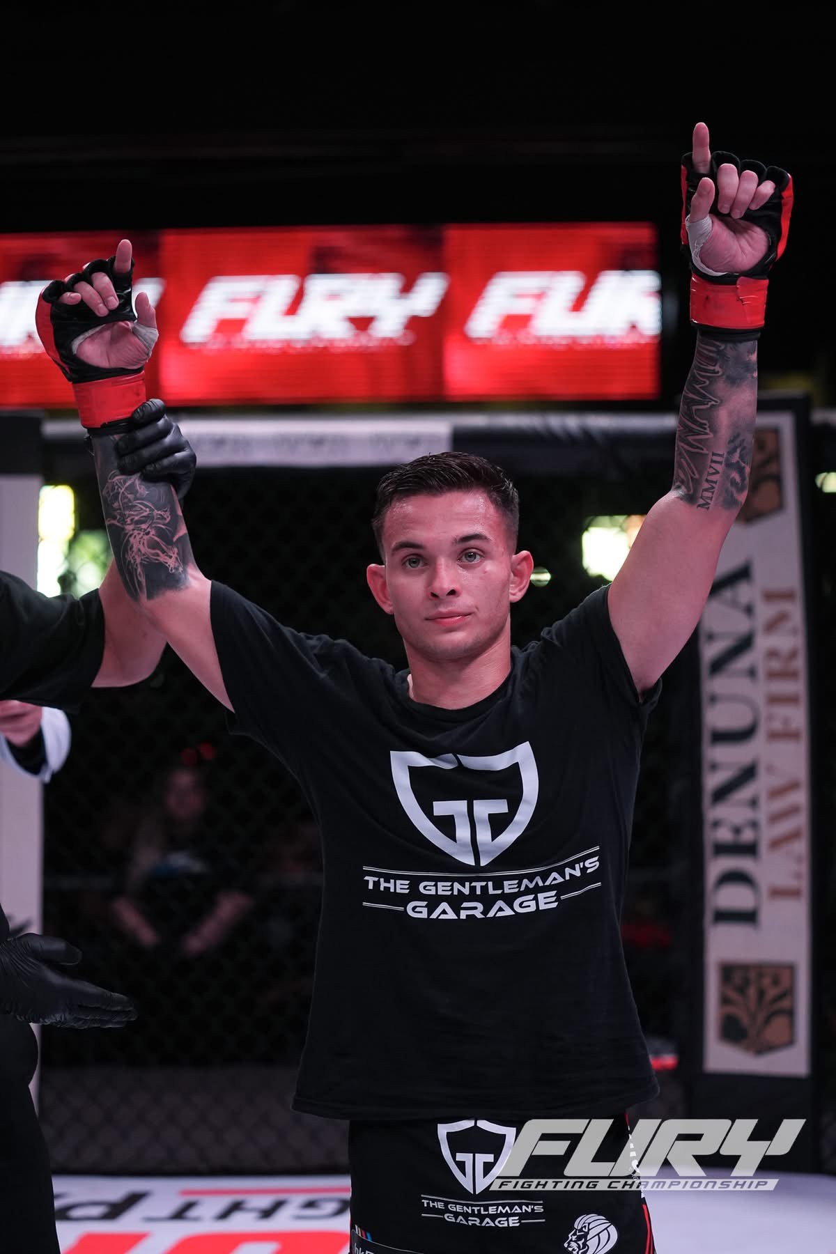 Micah White after a mixed martial arts victory with his hands raised