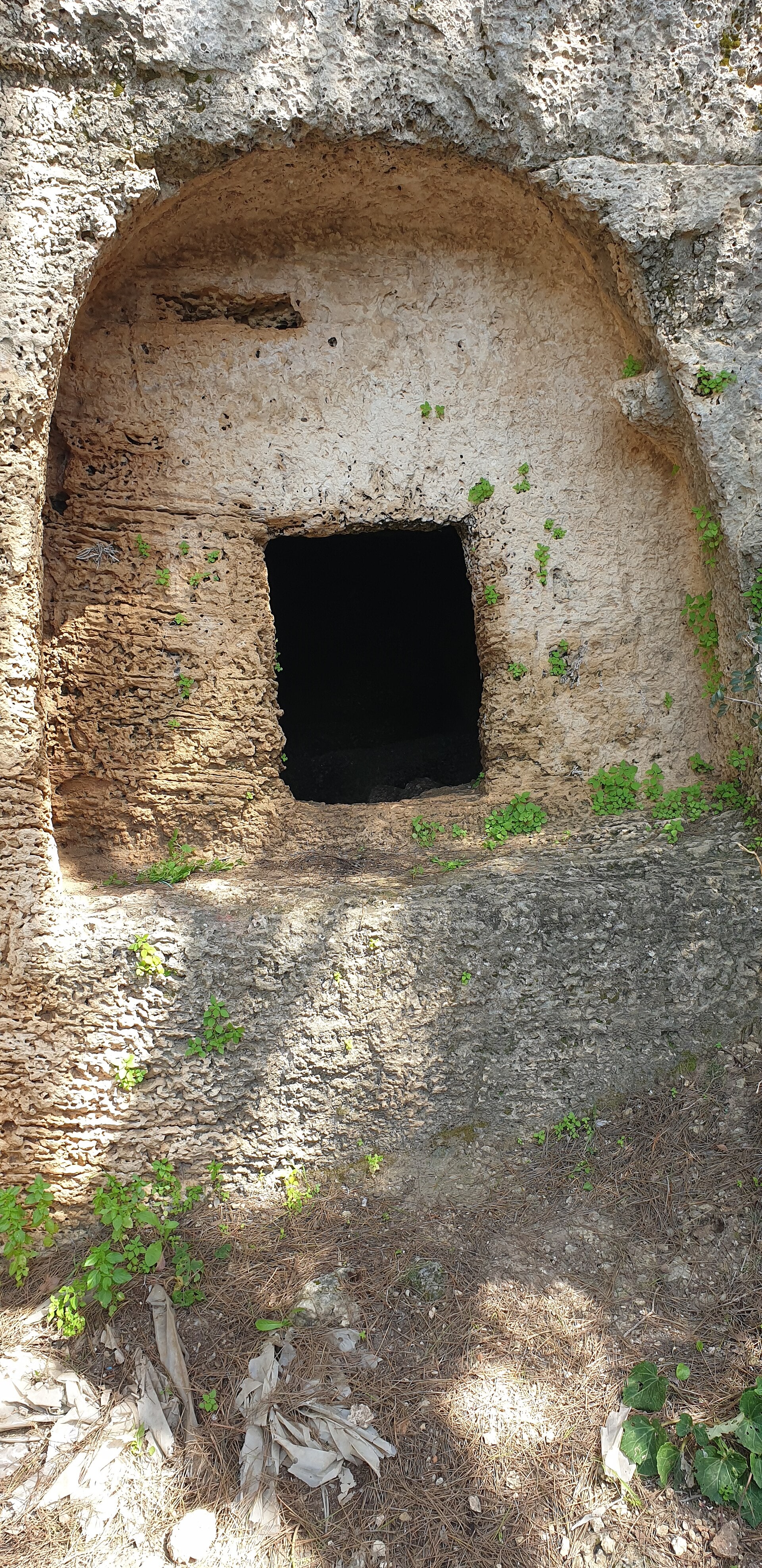 Rock-cut burial cave in a limestone hillside