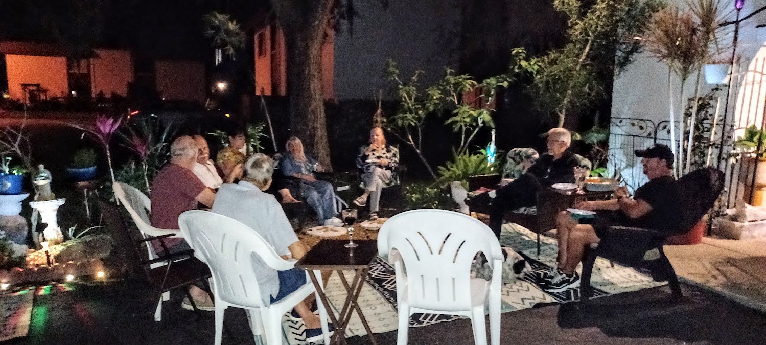 Community members in conversation outdoors