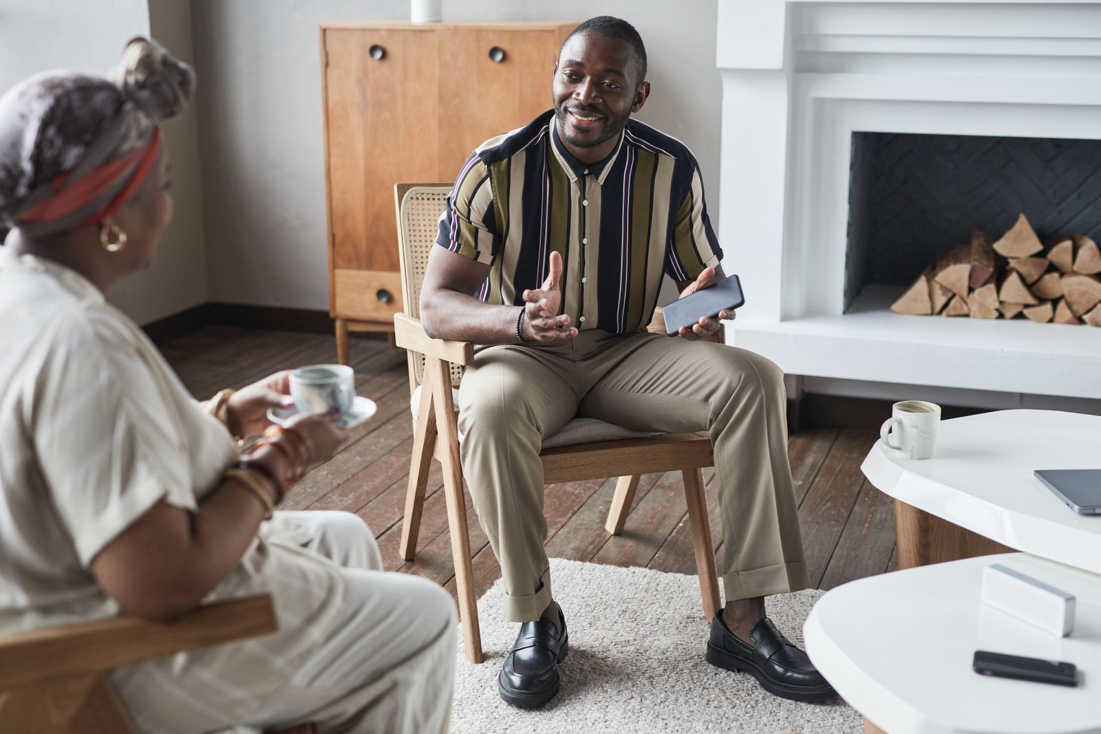 Two people sharing a warm conversation over coffee