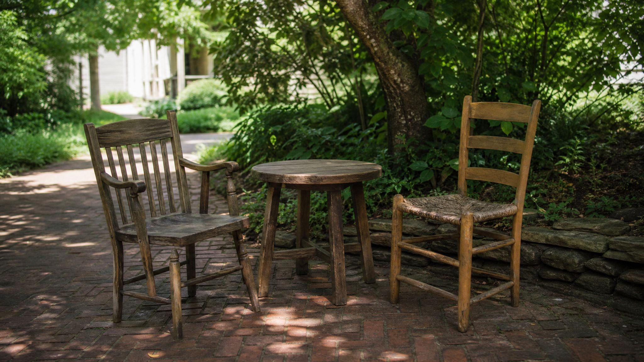 Two chairs beside a table in a quiet community courtyard.