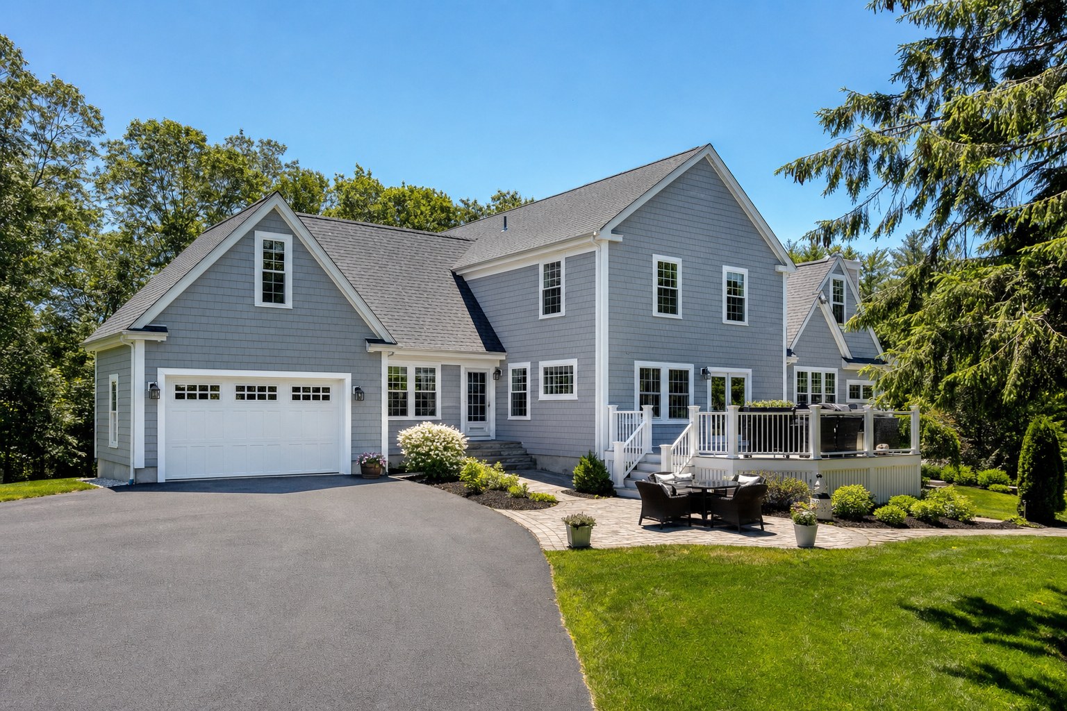 Clean New England home exterior and driveway