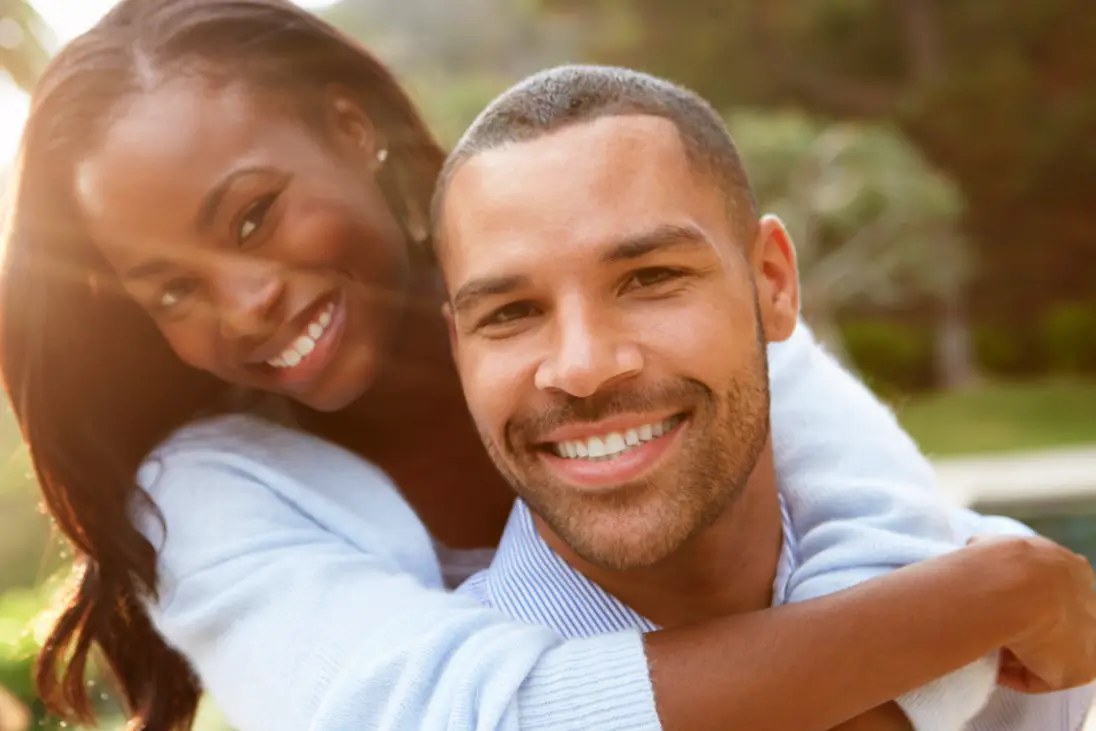 Two adults sharing a calm moment together outdoors