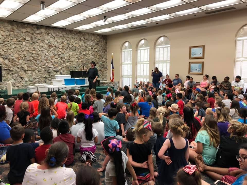 An audience enjoying a Snake Encounters presentation