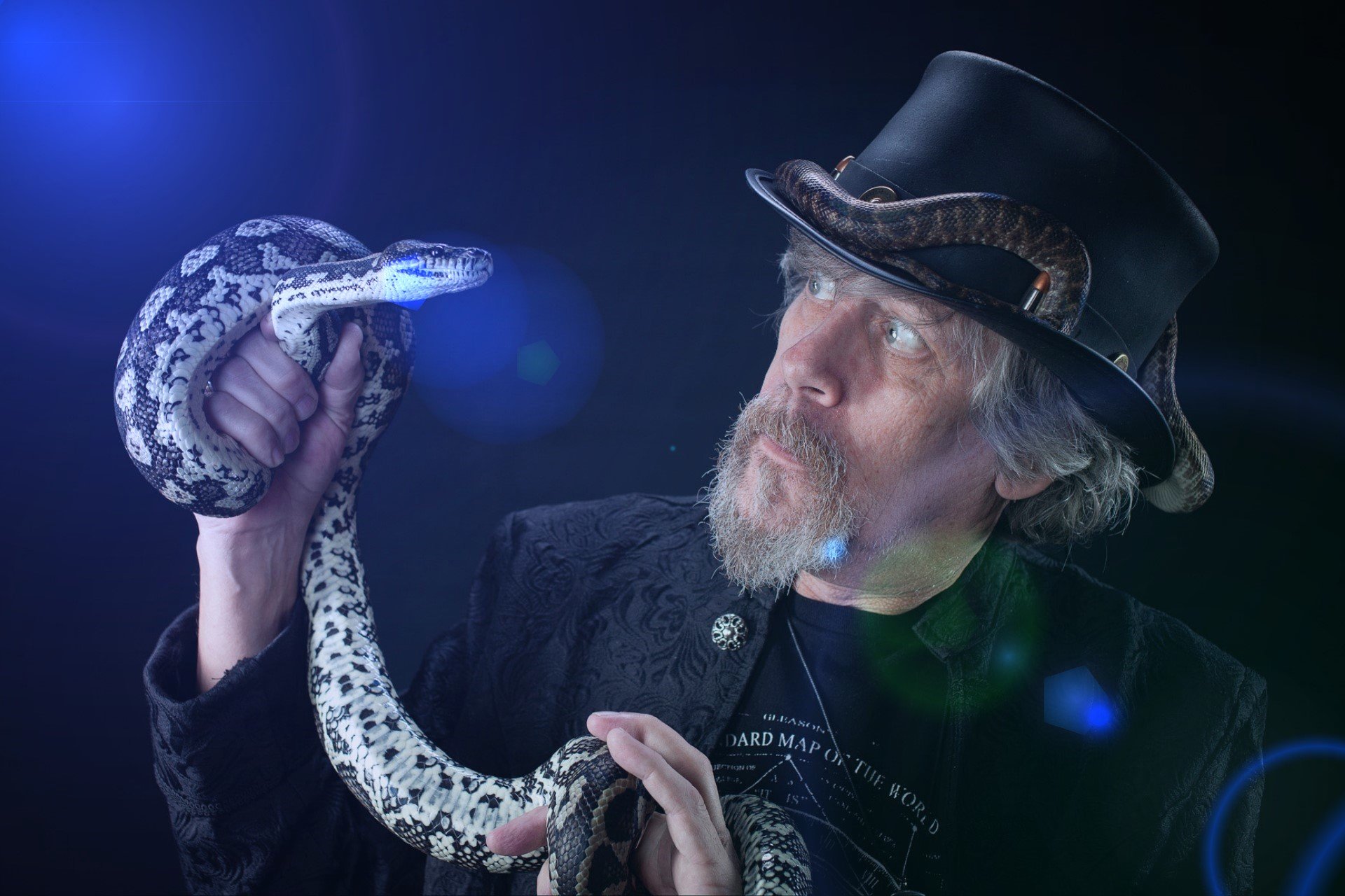 Daryl Sprout presenting a snake during a live show