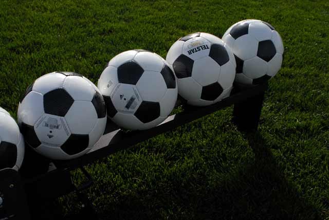 Coaches training with a soccer ball