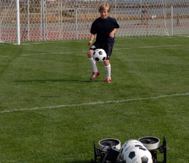 Players training with a soccer ball