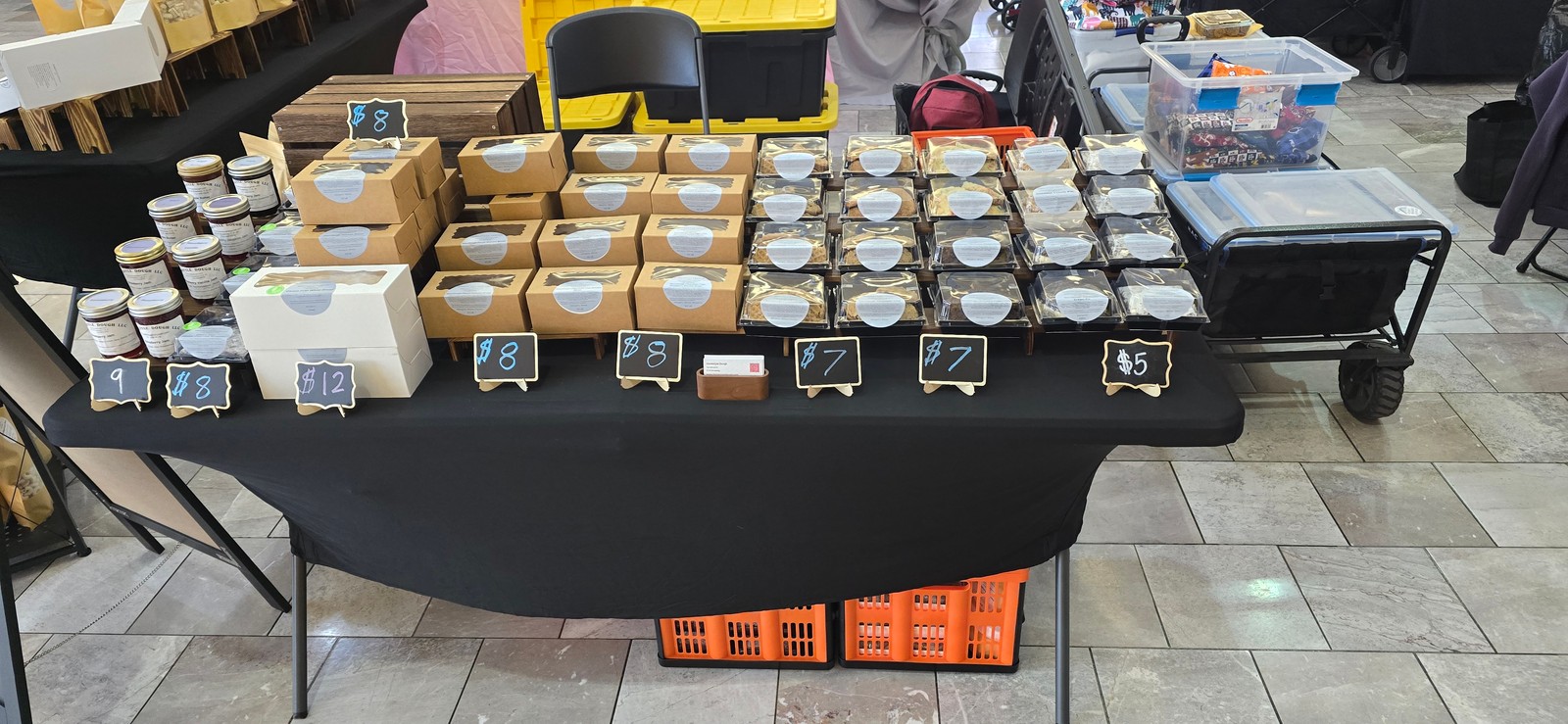 Homestyle Dough baked goods and jars arranged on the market table