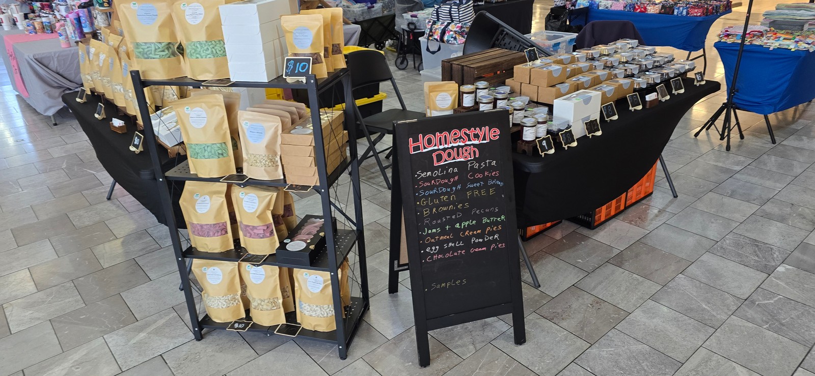 Homestyle Dough market setup with pasta display and baked goods