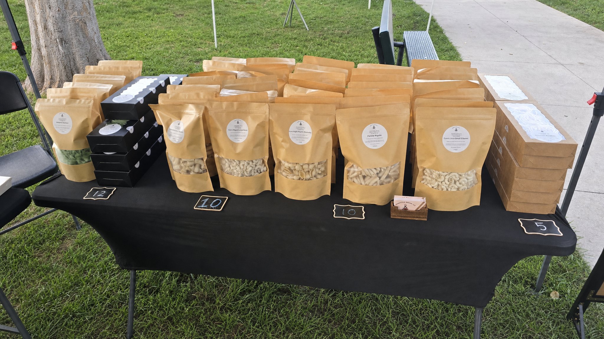 Homestyle Dough pasta and baked goods arranged at the market