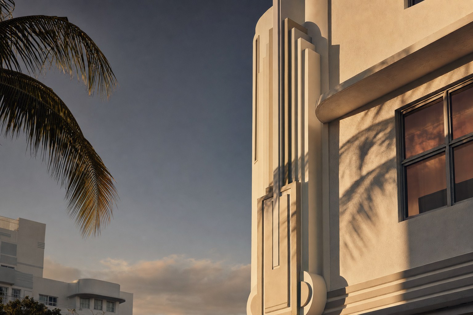 Sunlit Art Deco building and palm shadow in Miami