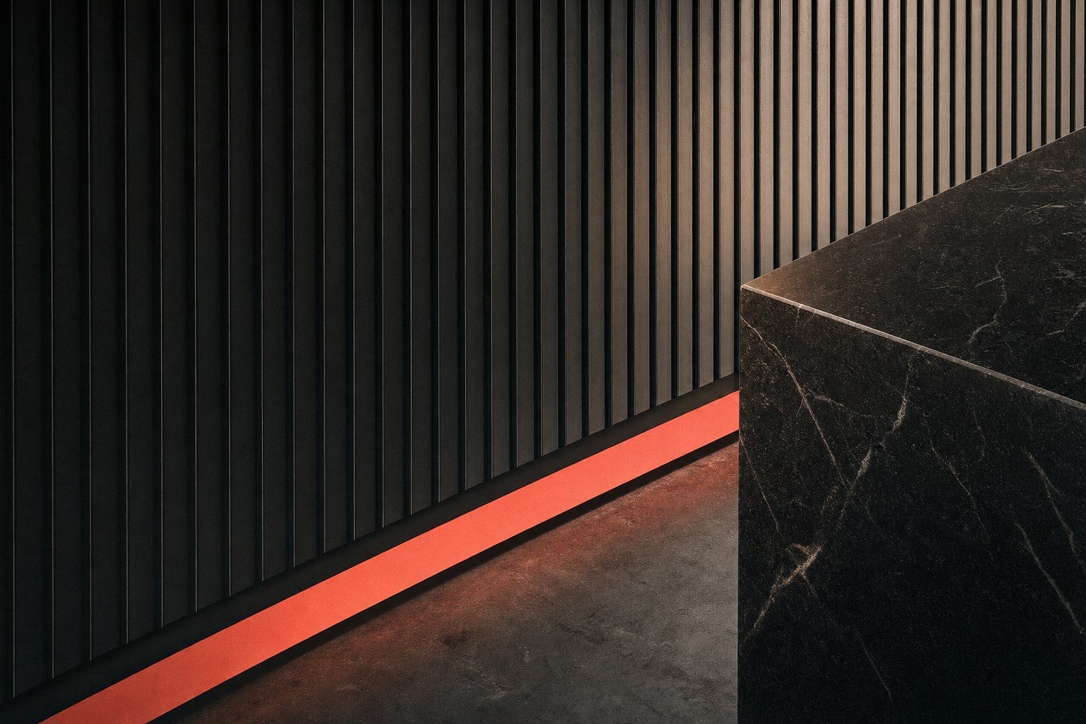 Ribbed black wall panels and coral floor detail