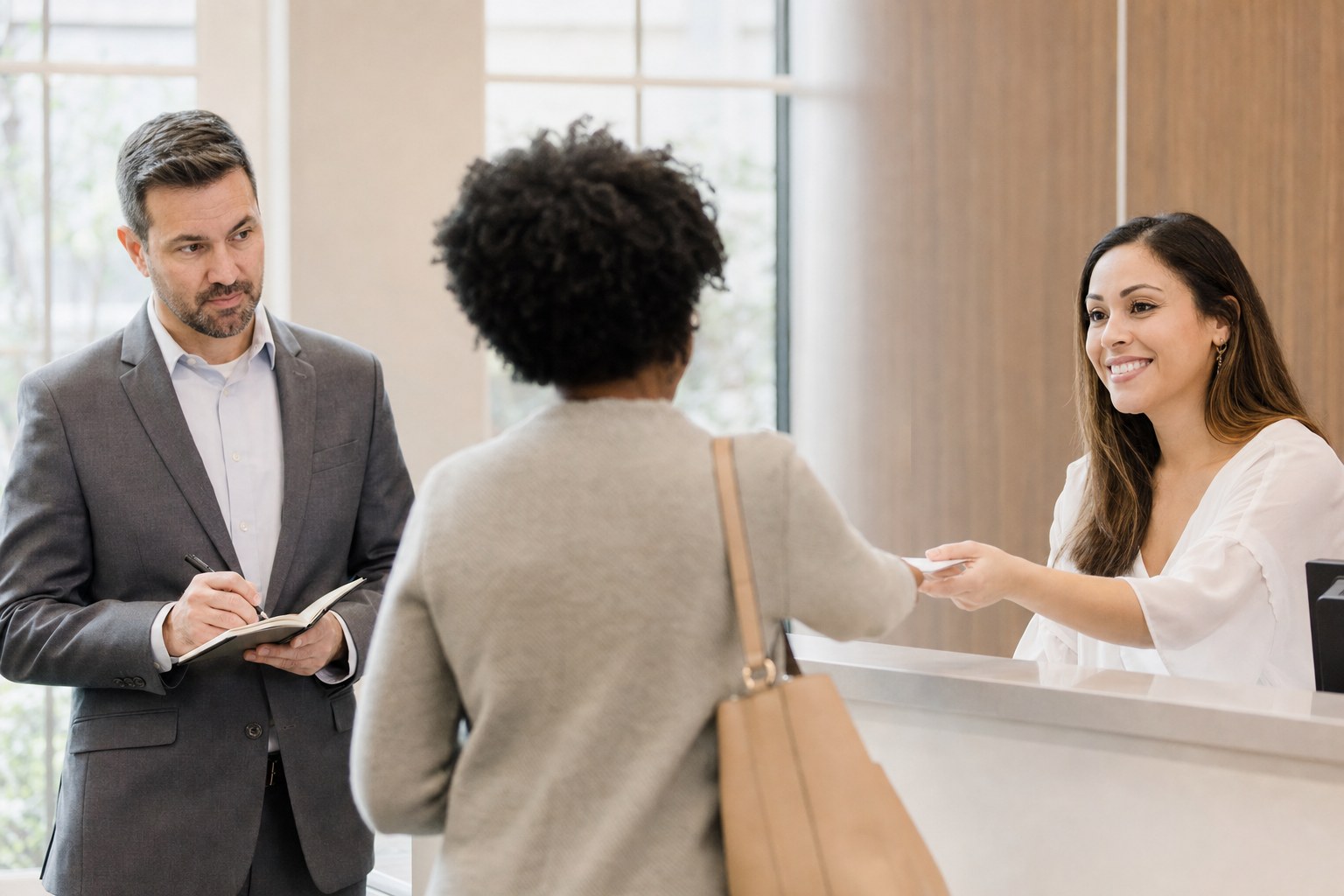 A manager observing a customer welcome at a service counter