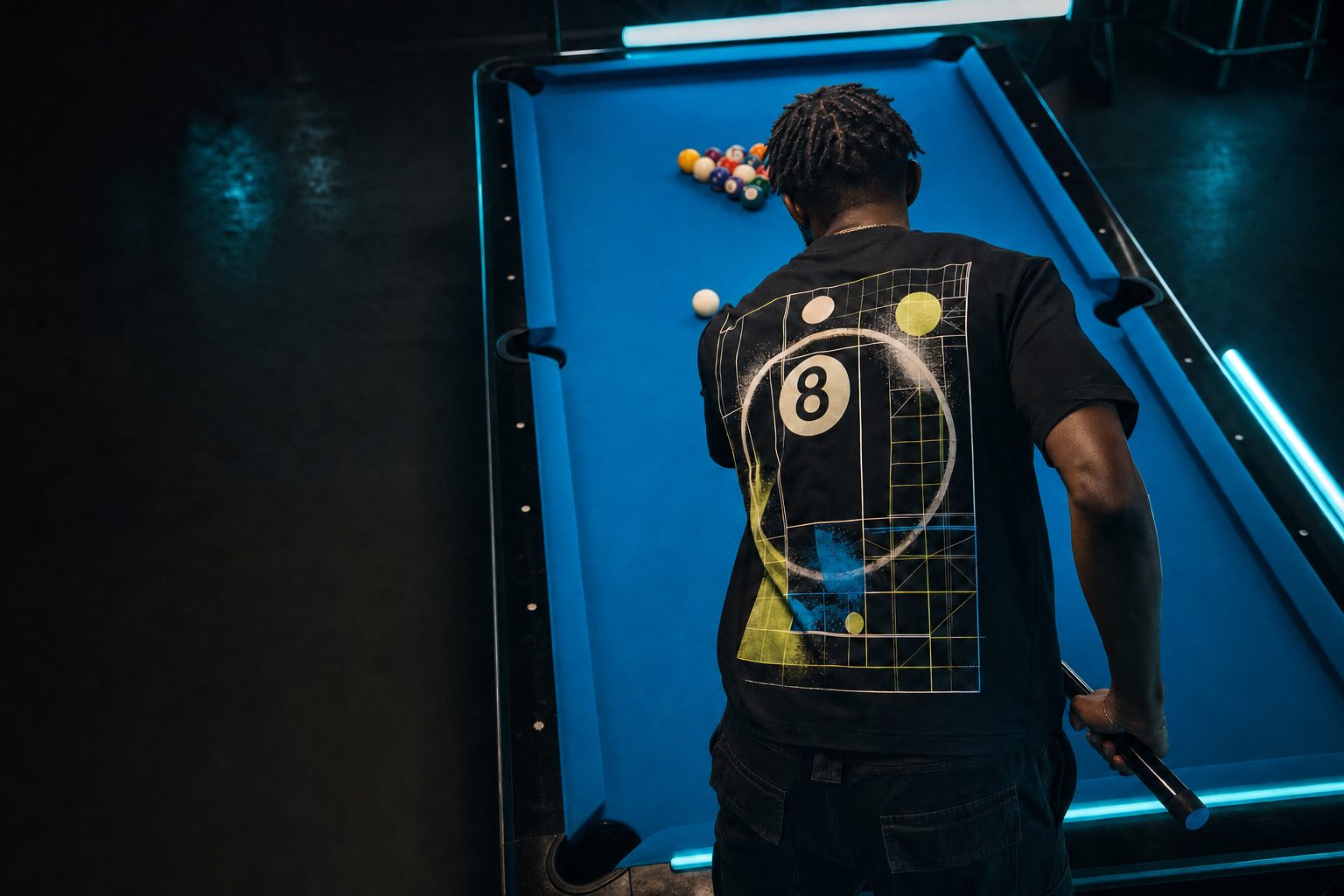 Pool player lining up a shot while wearing STR8 SHOT streetwear