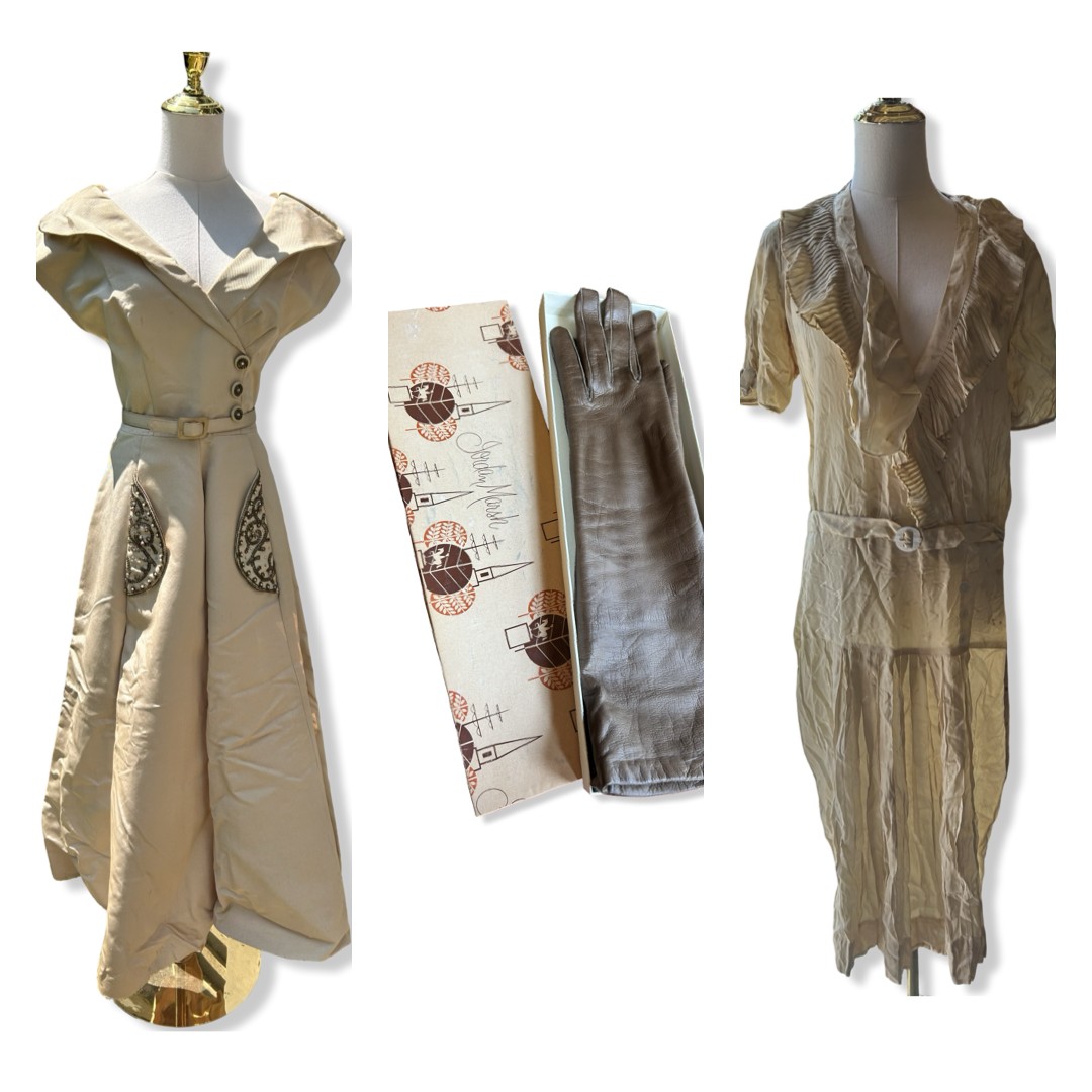 Vintage dresses, gloves, and fabric displayed on mannequins