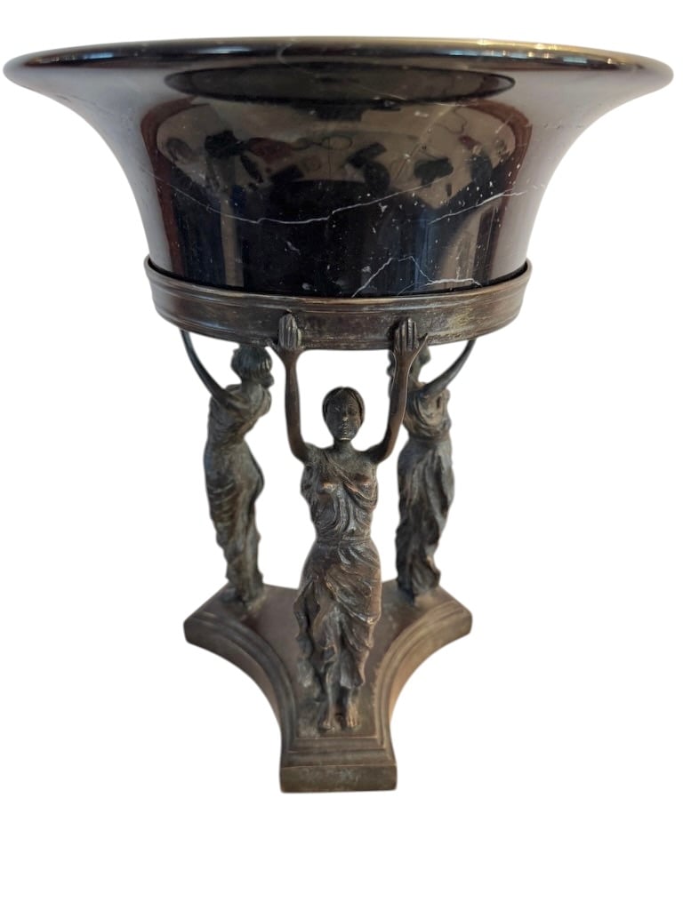 Silver centerpiece held by sculpted figures, offered in the Dennis Canali estate auction