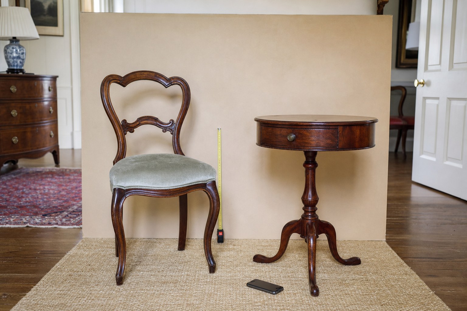 Vintage chair and table documented with a measuring tape and neutral backdrop