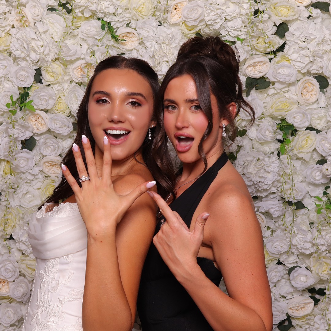 Bride and wedding guest posing for a color photo booth portrait at Camello in Phoenix