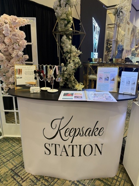 The Pose Garden Keepsake Station displaying photo keychains and event keepsake examples for quinceañeras