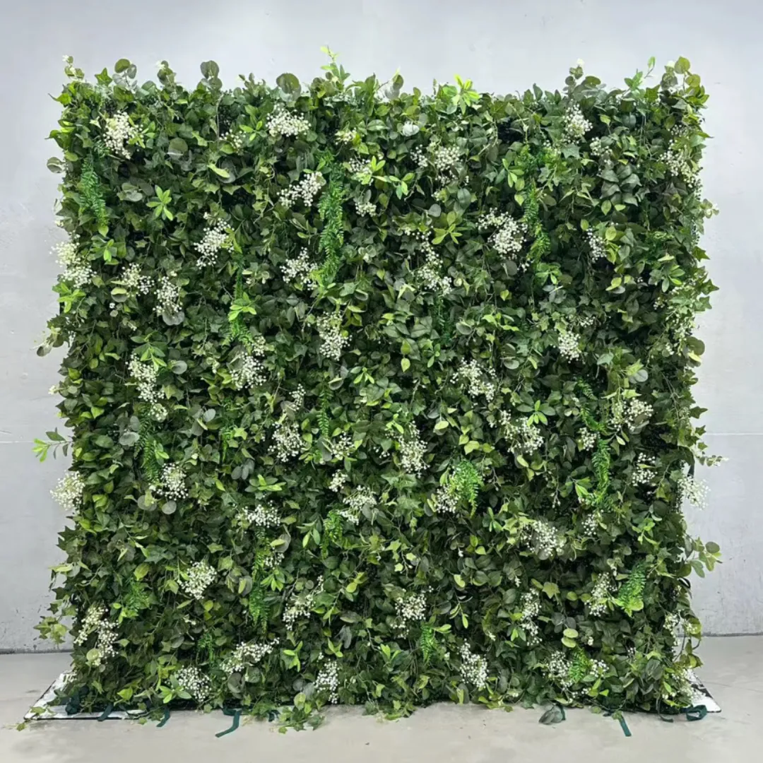 Sawyer flower wall with mixed greenery and white blooms