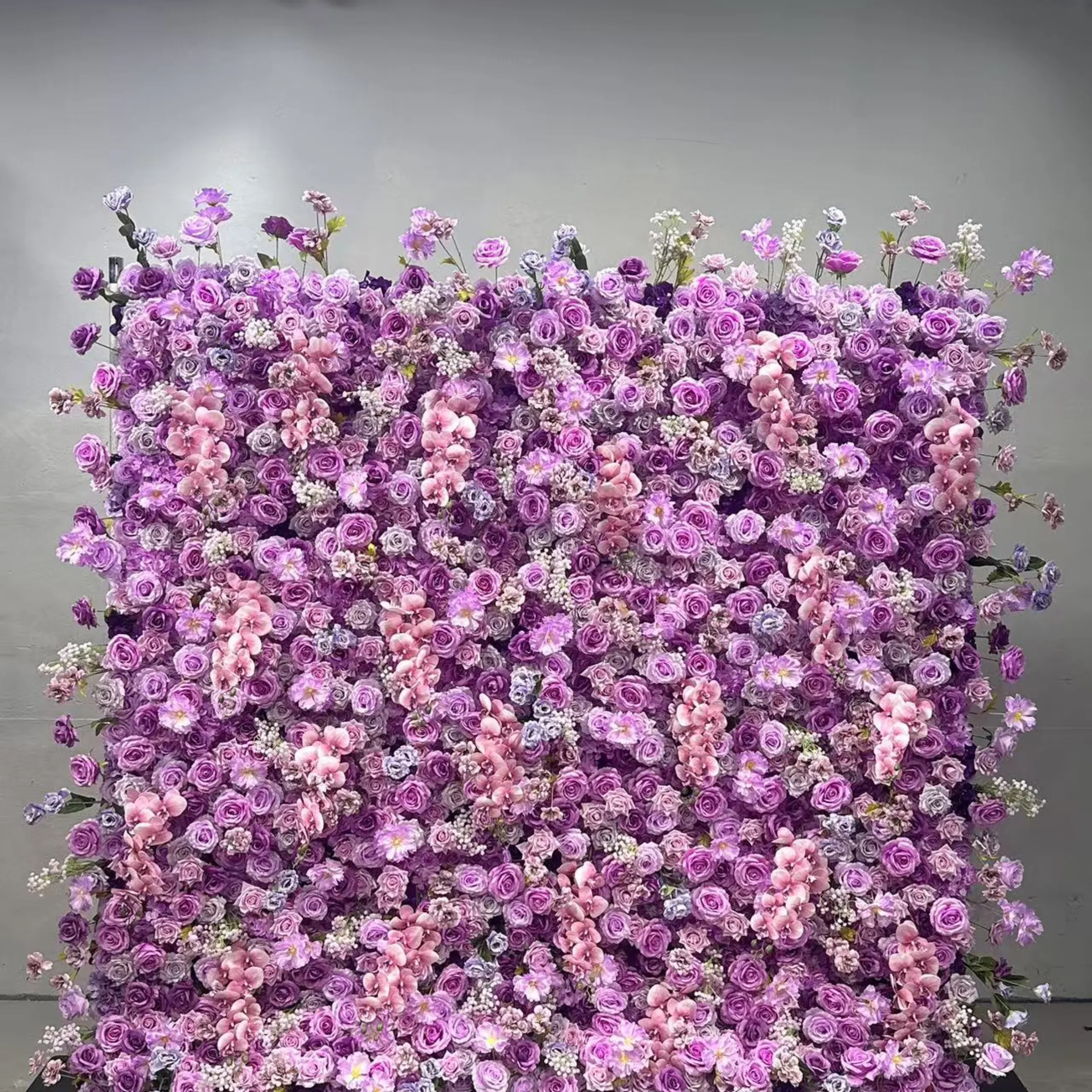 Violet flower wall with lavender and purple blooms
