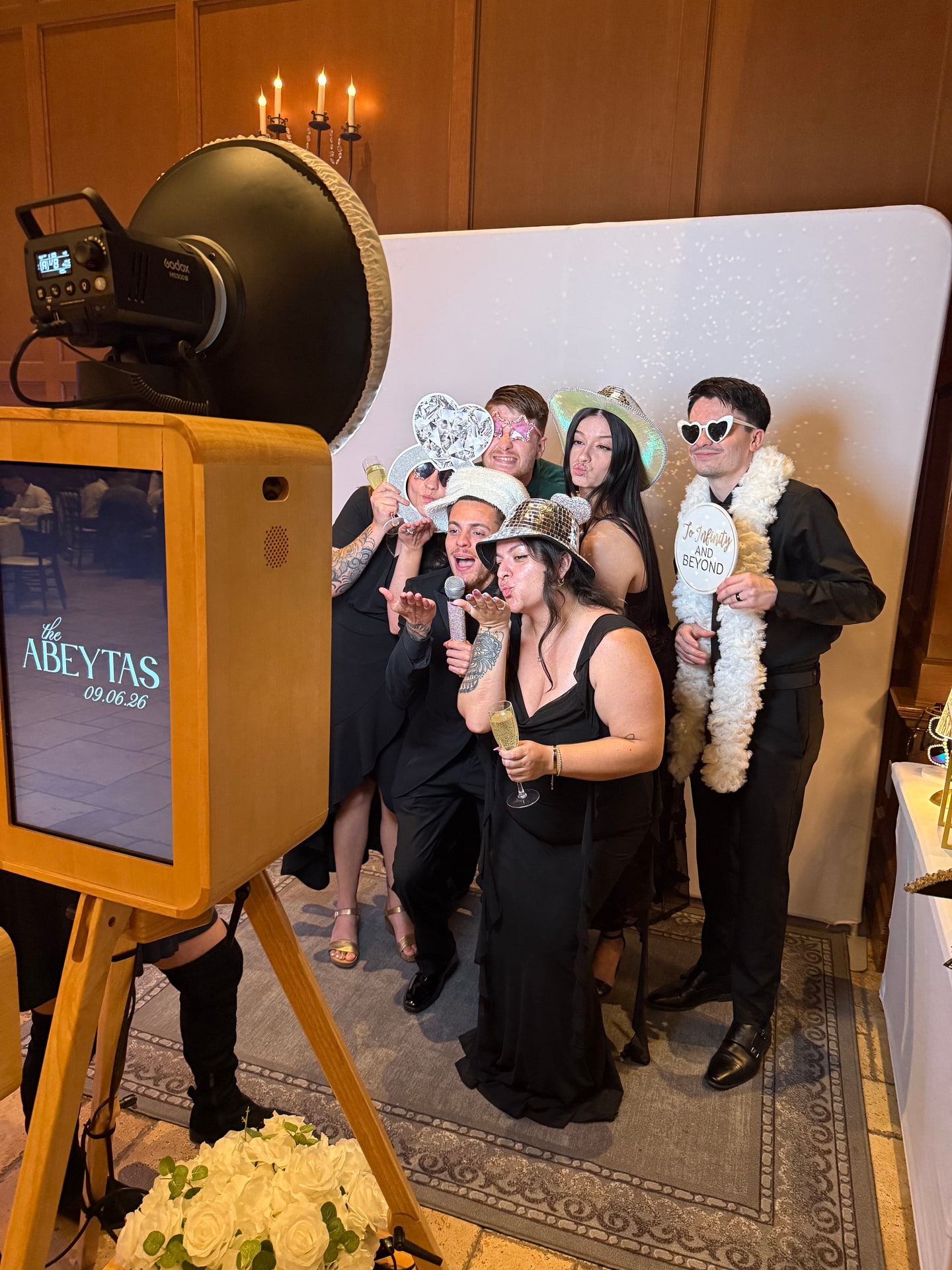 Guests enjoying a Photo Booth at a formal celebration
