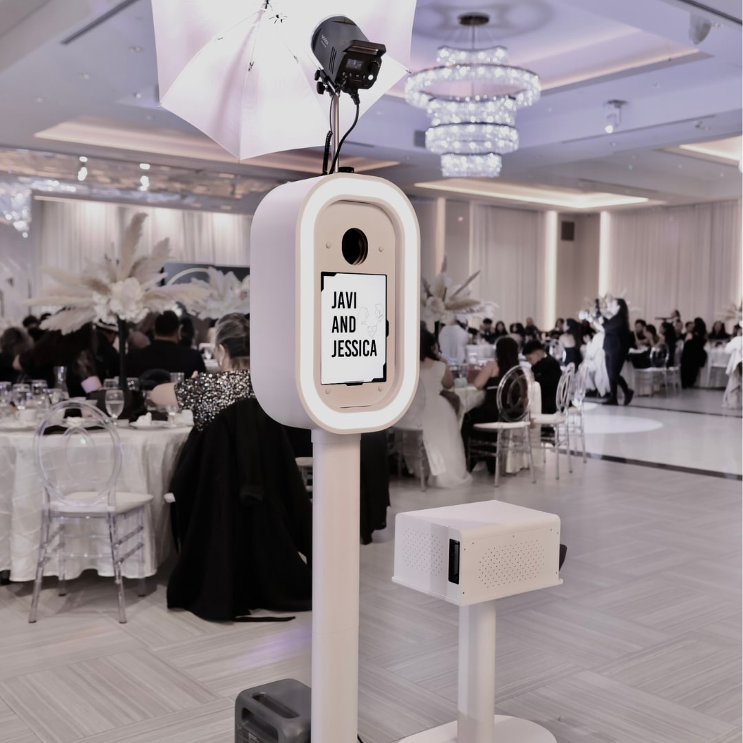 White Photo Booth with professional lighting at a ballroom wedding reception