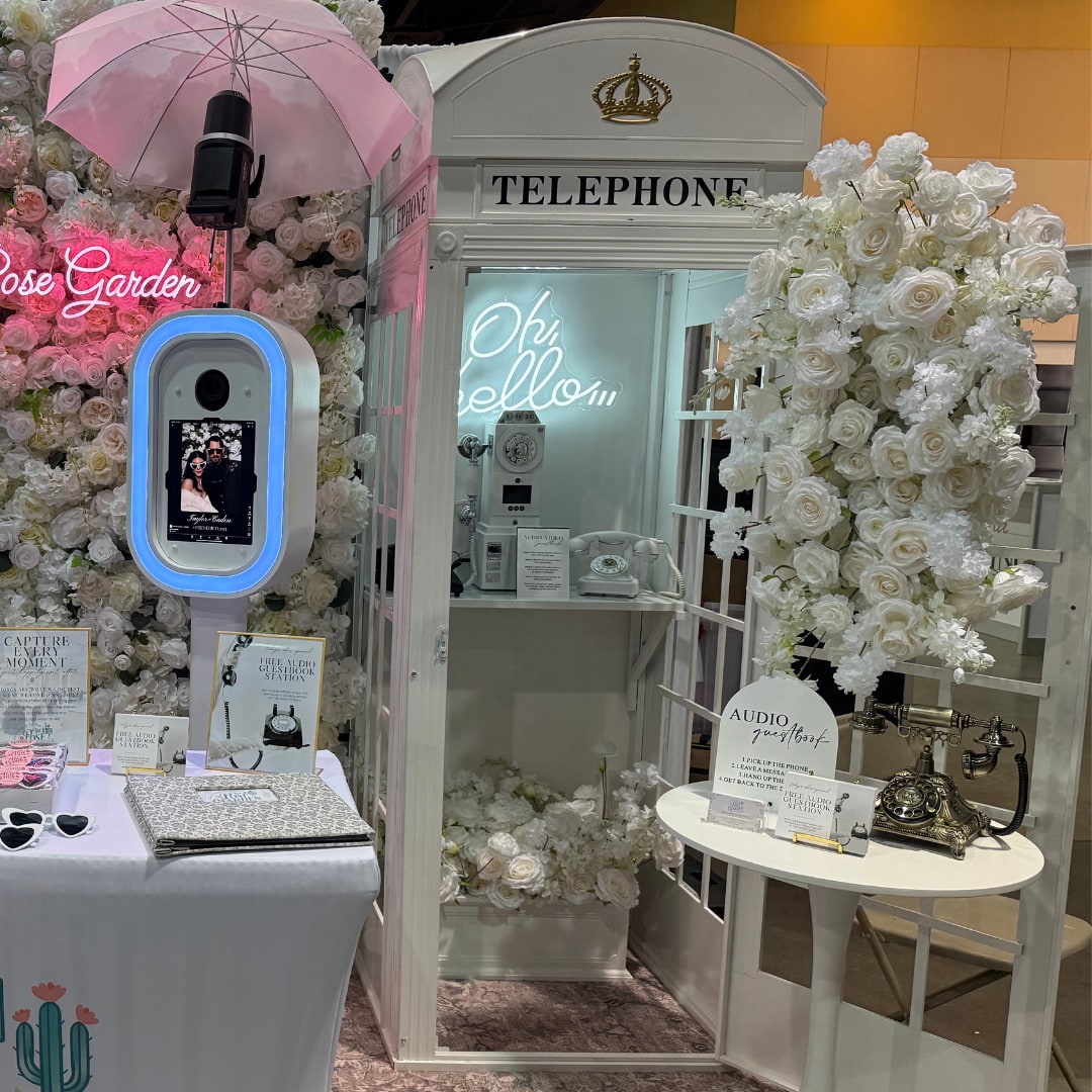 White floral telephone booth and Audio Guestbook display at a wedding show
