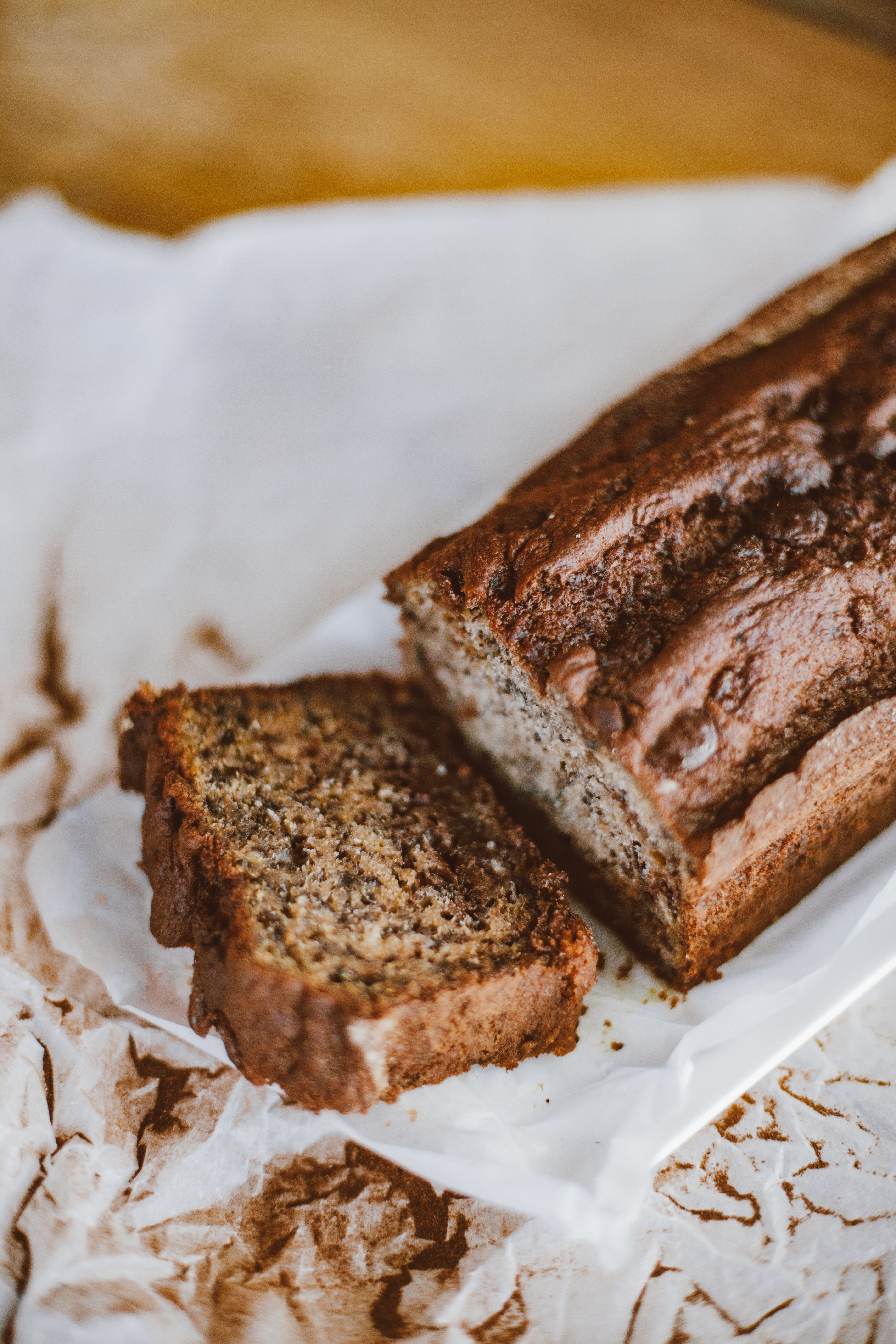 A sliced loaf of banana bread fresh from the oven