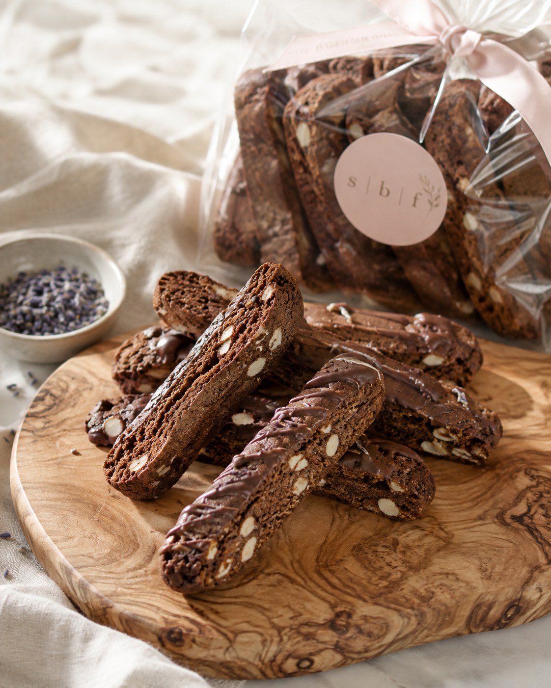 Chocolate almond biscotti arranged on a wooden board