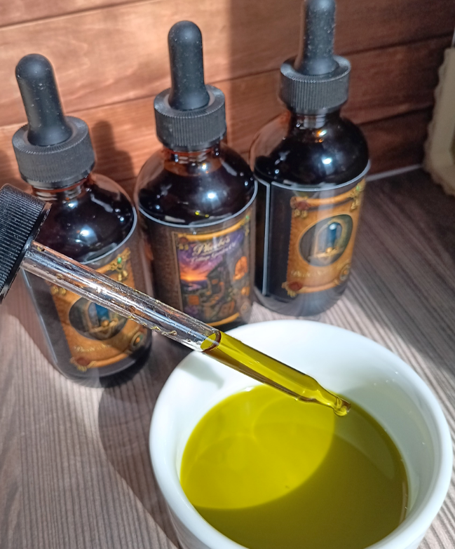 Green botanical oil in a glass dropper
