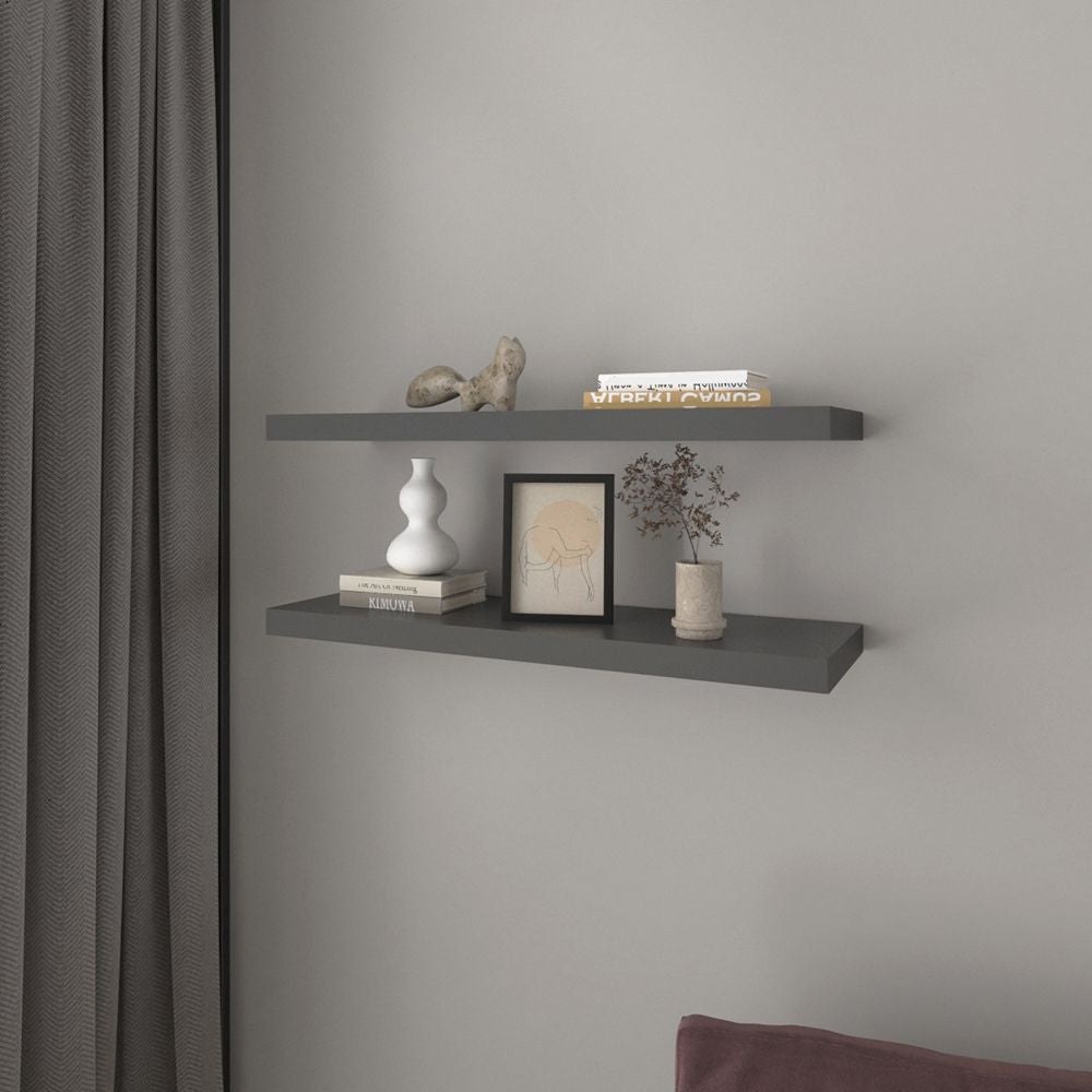 Wall-mounted floating shelf that helps move accessories off a compact desk surface
