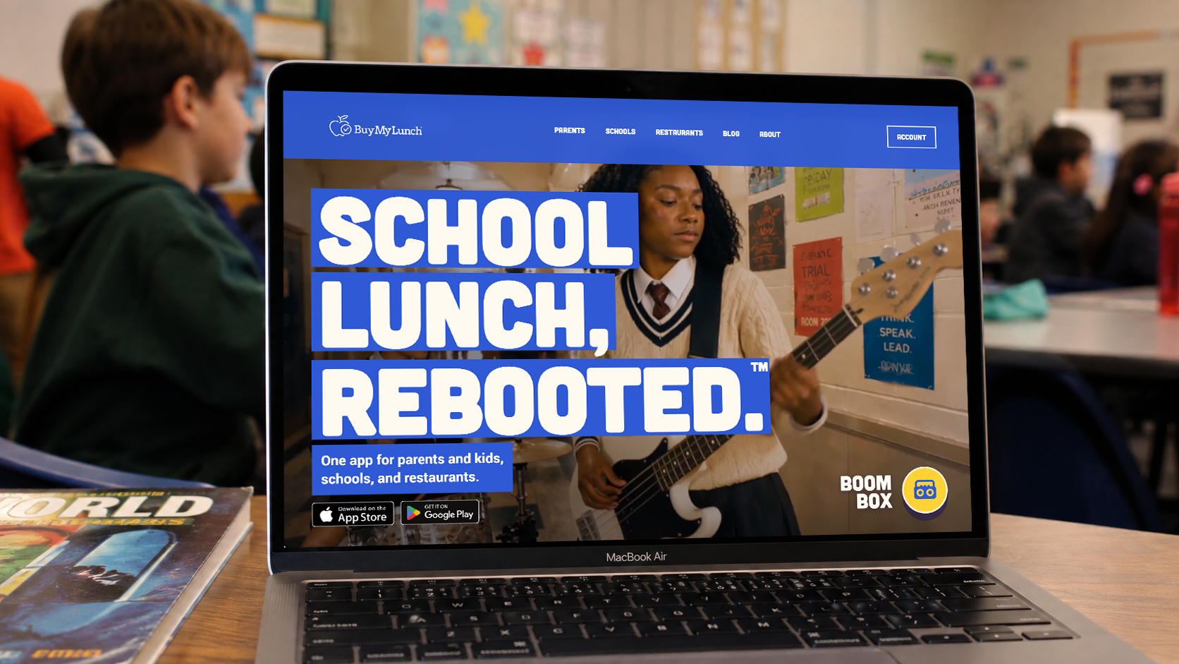 Buy My Lunch website shown on a laptop in a school classroom