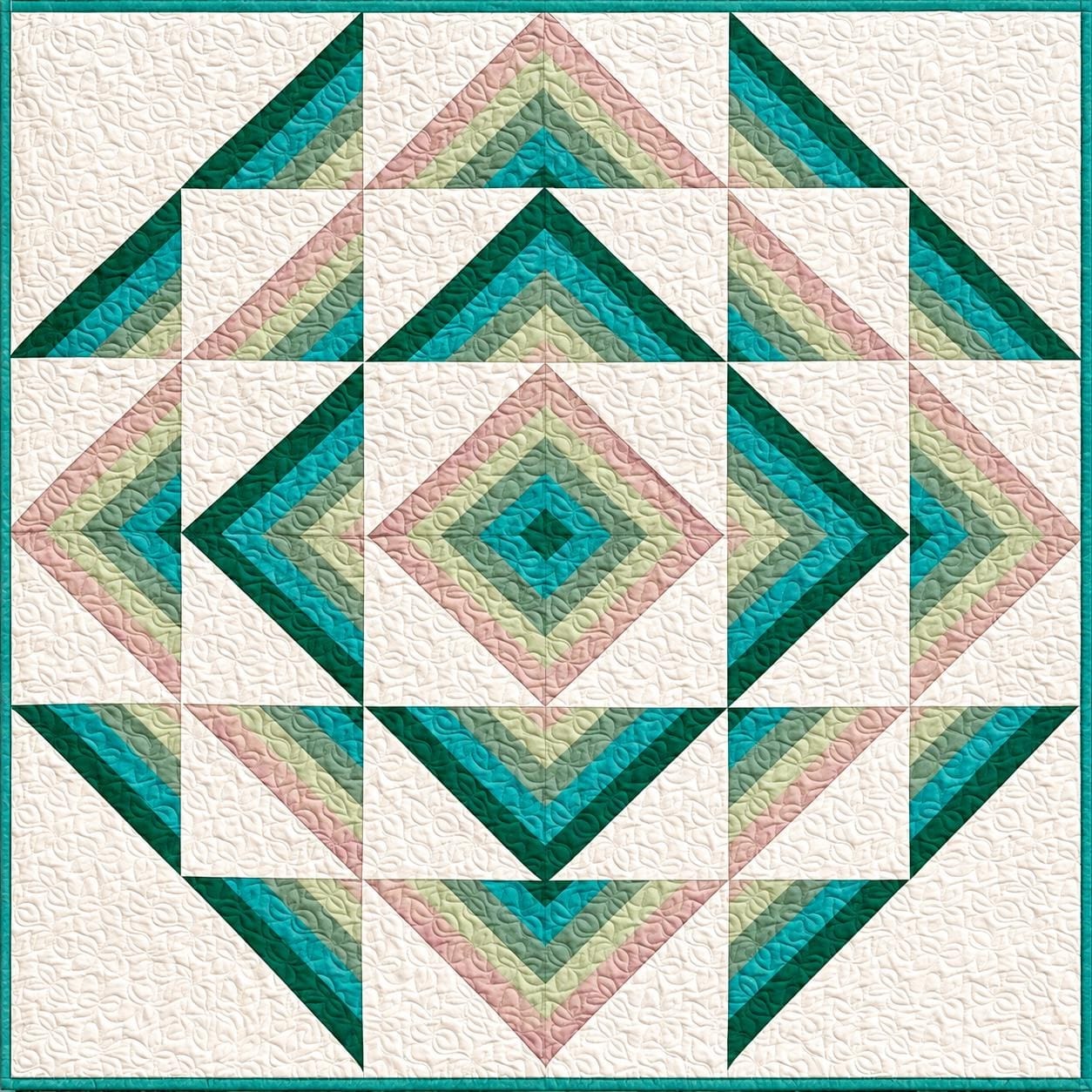Teal, mint, blush, and white fabric in a geometric quilt