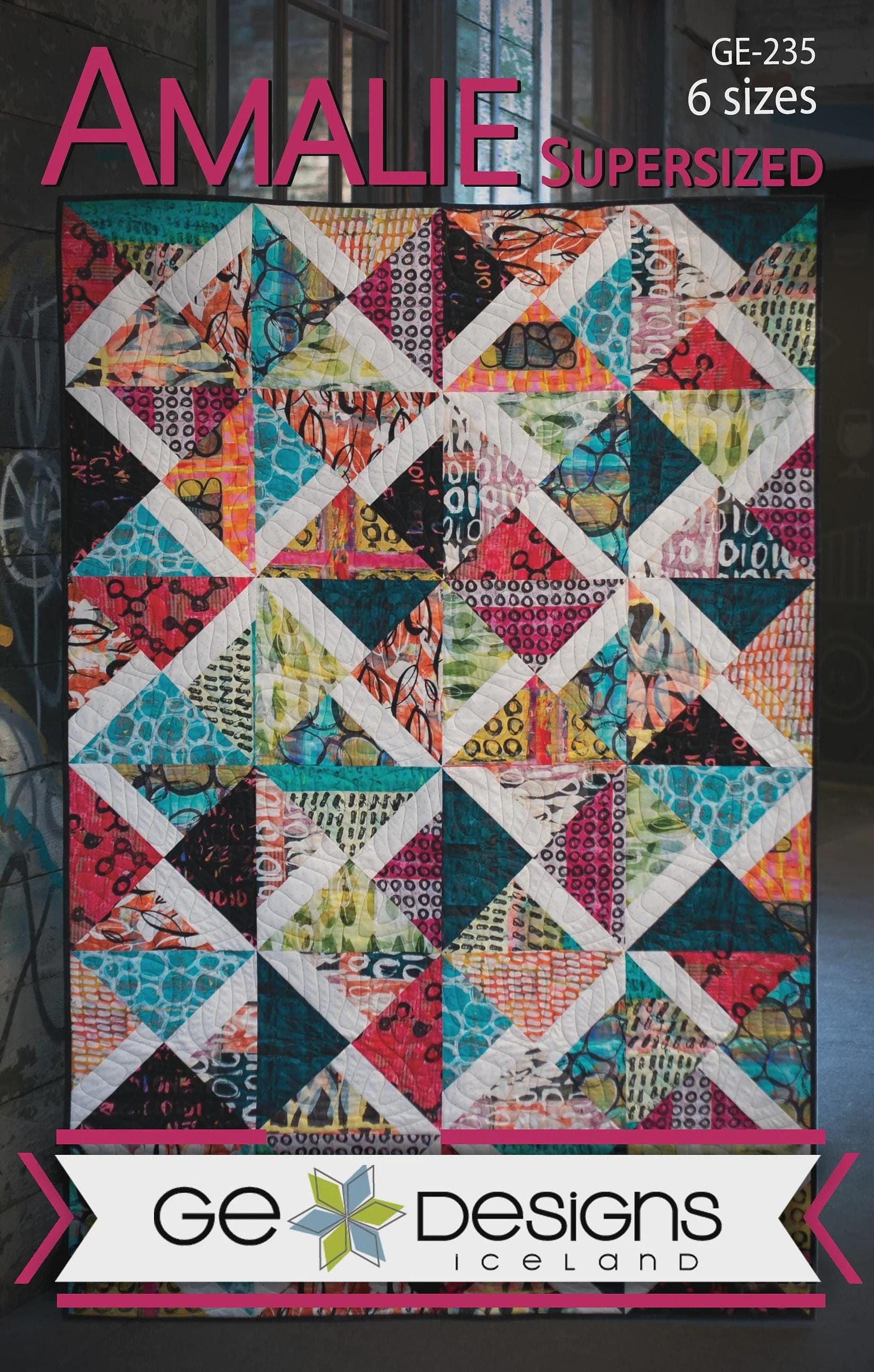 A detailed finished quilt showing coordinated fabric and straight borders