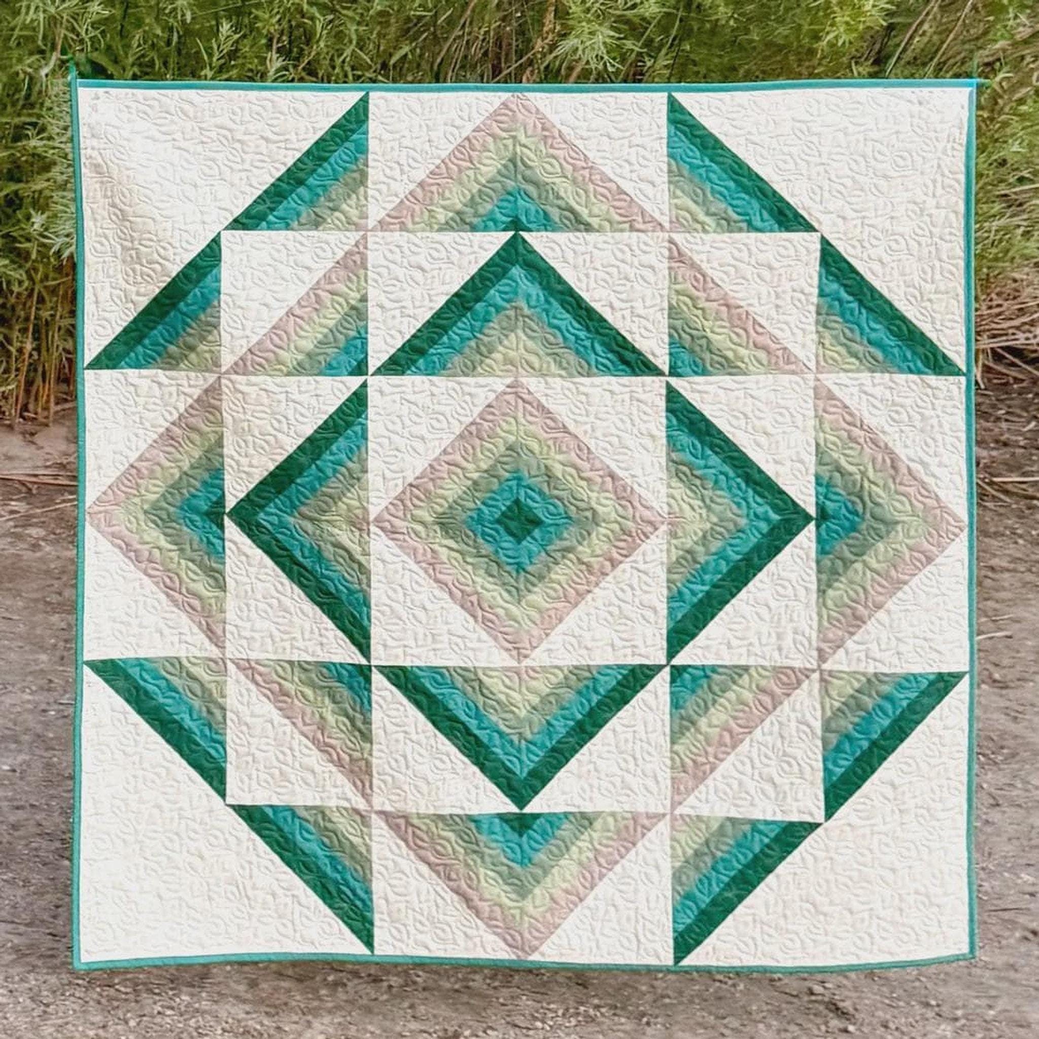A close view of geometric quilt blocks and crisp fabric edges