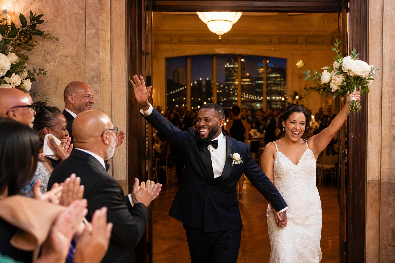 Newlyweds making a joyful entrance into their reception
