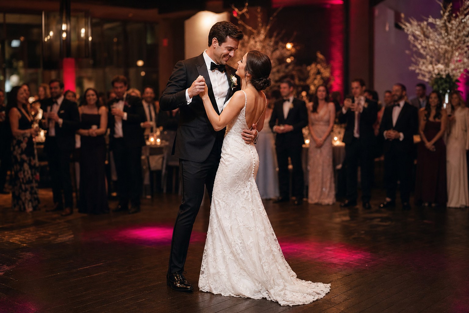 Newlyweds sharing a joyful dance at their wedding reception