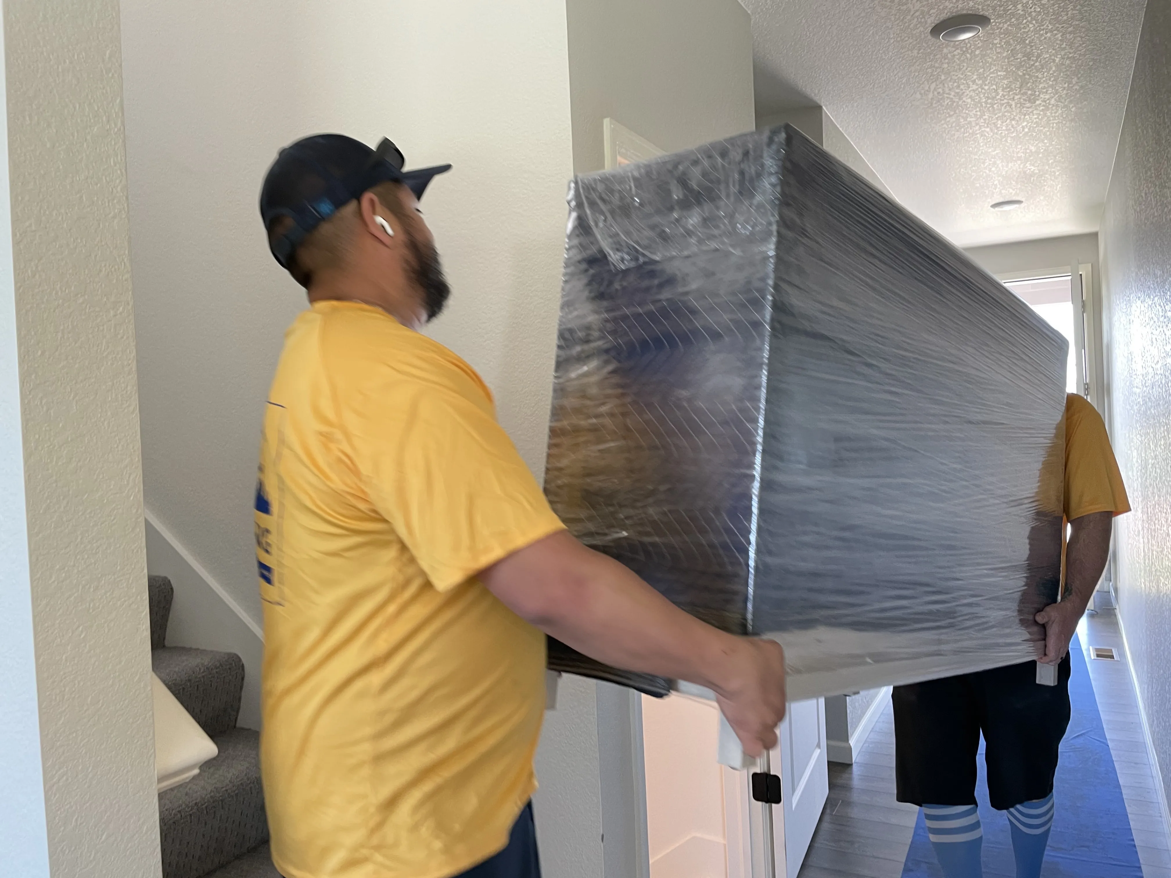 Get Moving team member packing a box