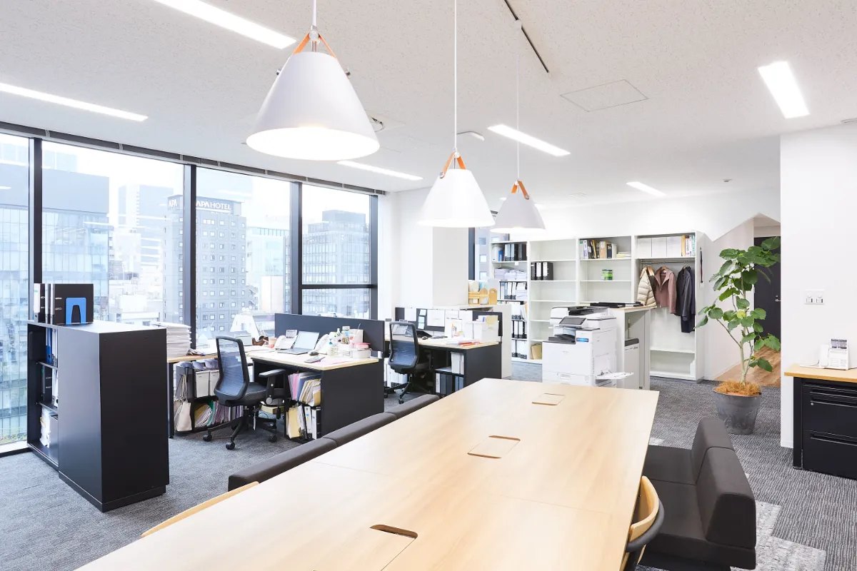 Office team reviewing a floor plan in a Phoenix workspace
