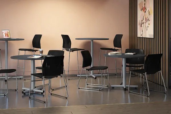 Breakroom seating and shared tables in a modern office
