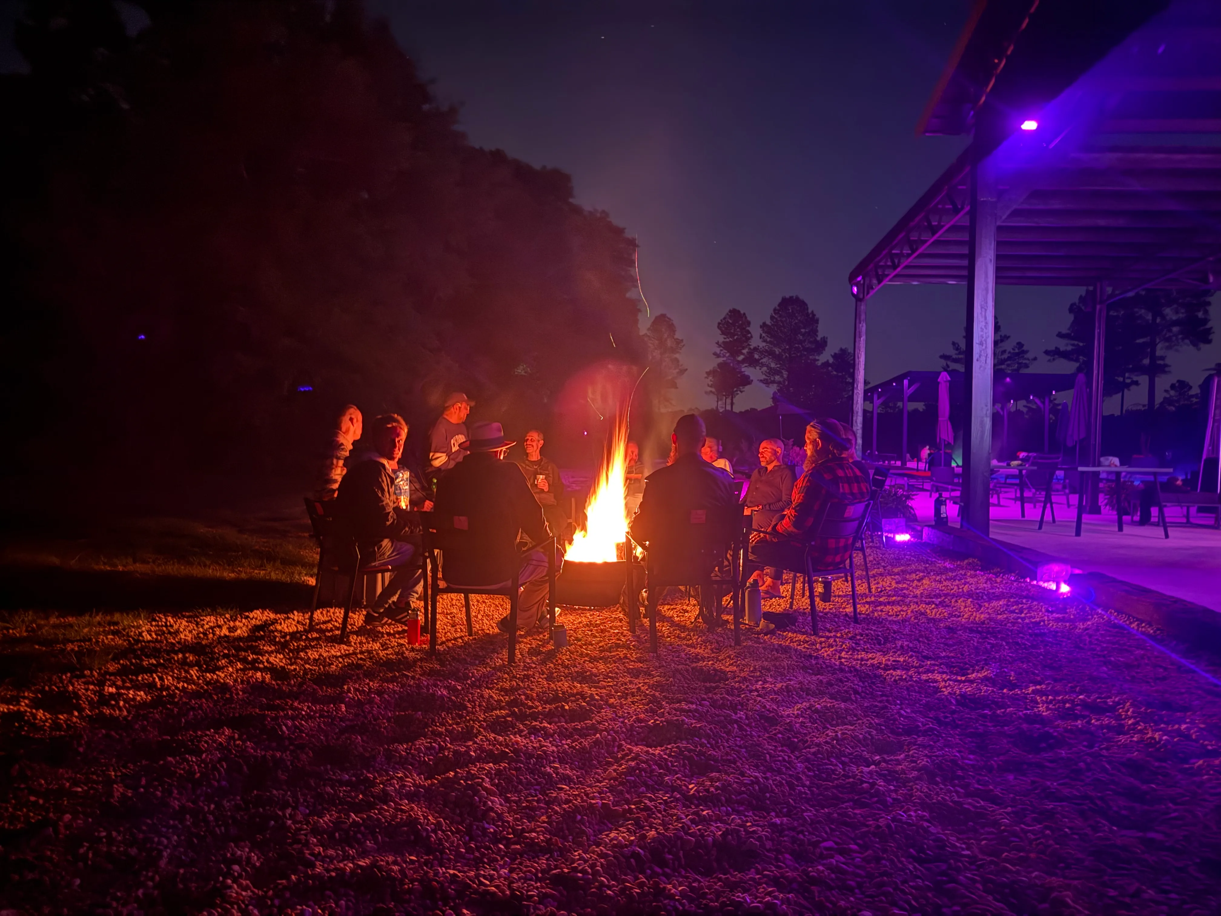 Farmcamp guests gathered by the campfire