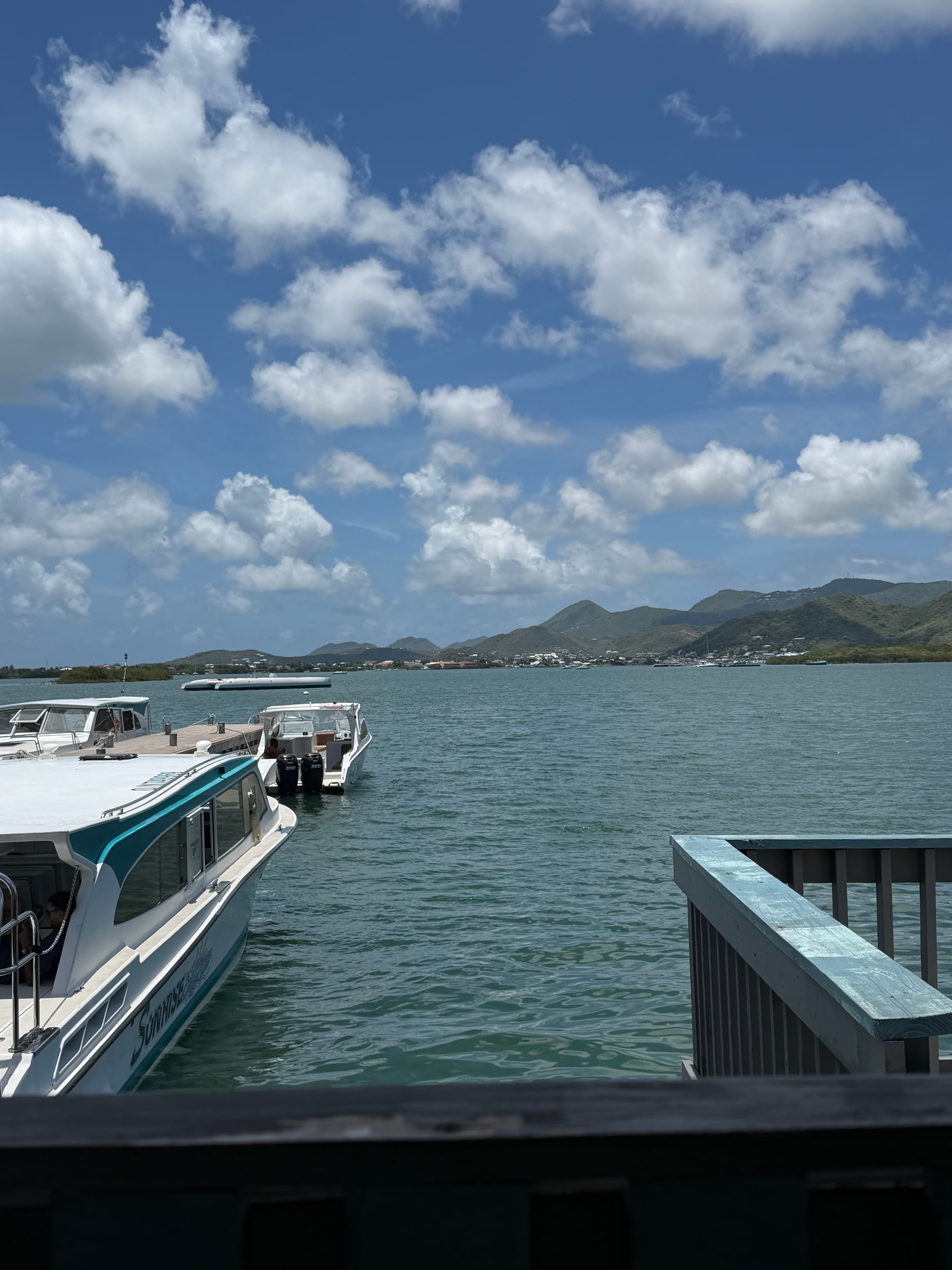 Boats gathered along a Caribbean shoreline