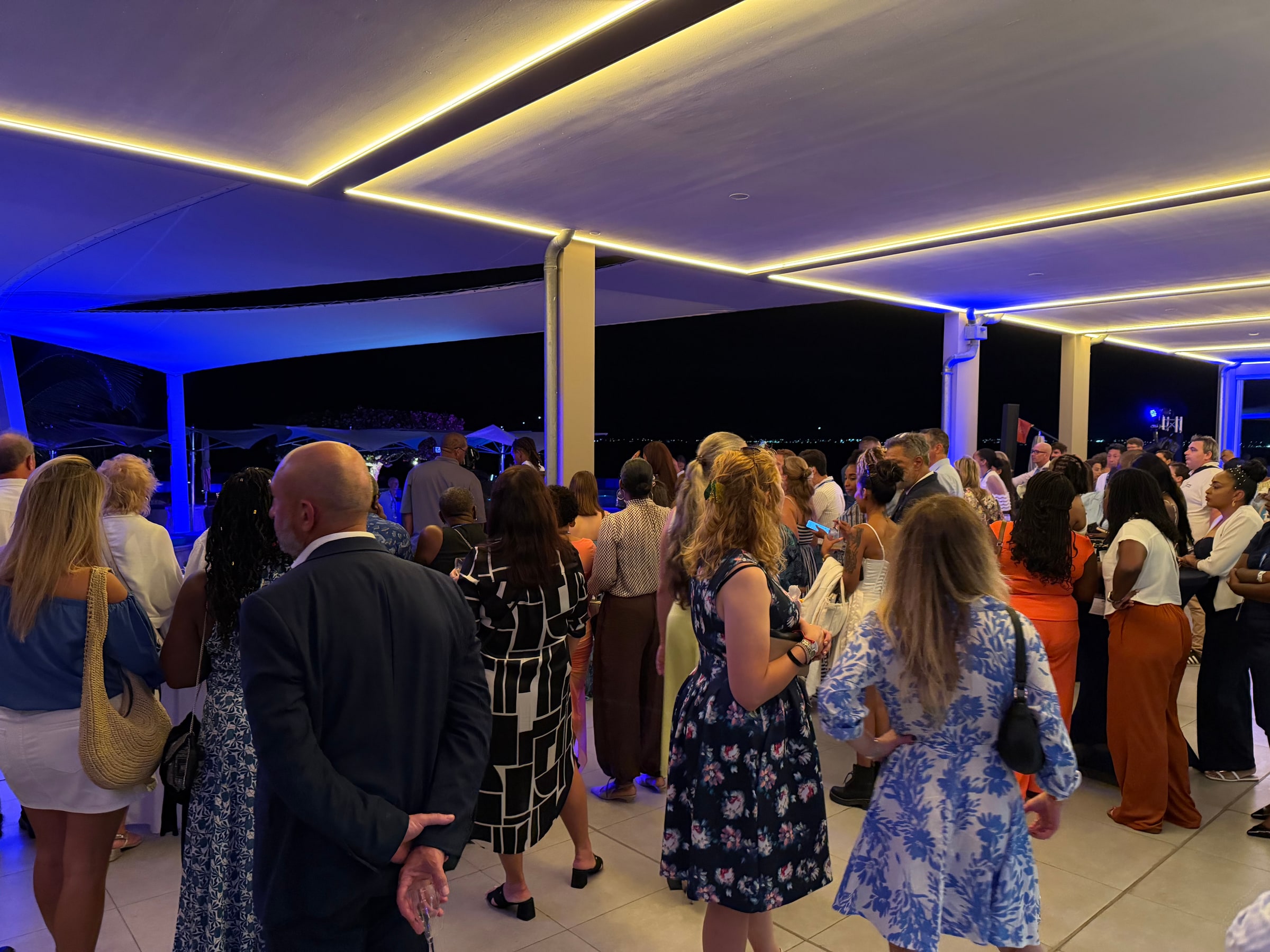 Guests gather at an evening corporate event