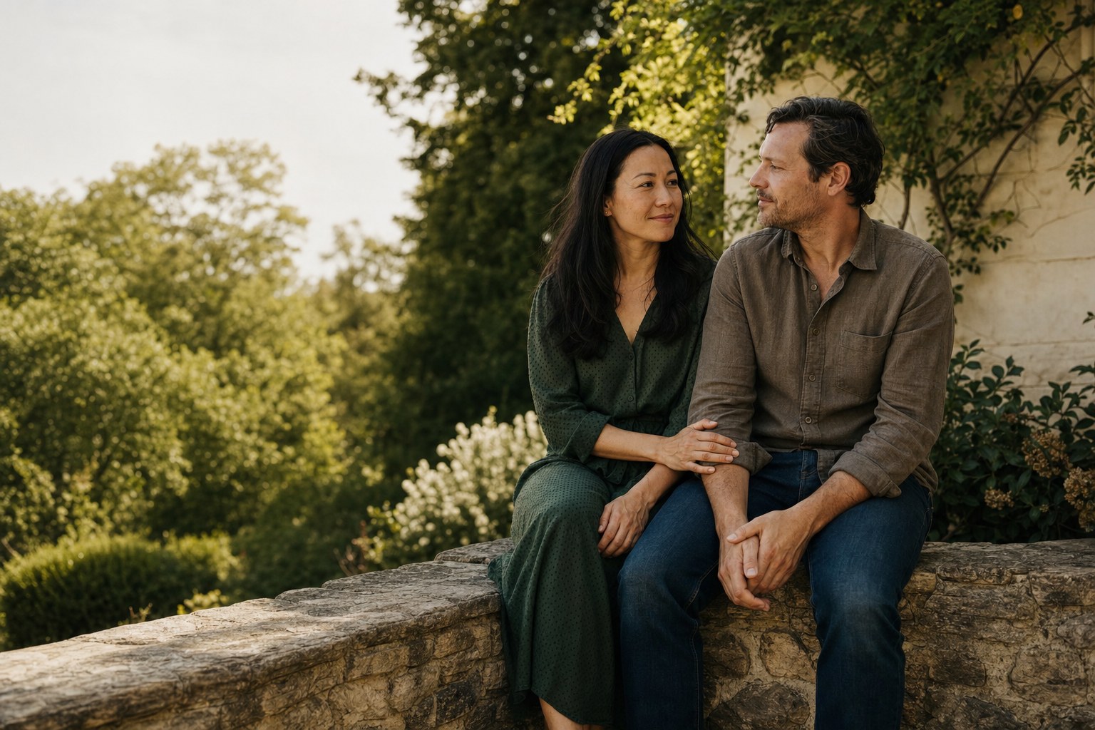 Couple sitting together in a sunlit garden