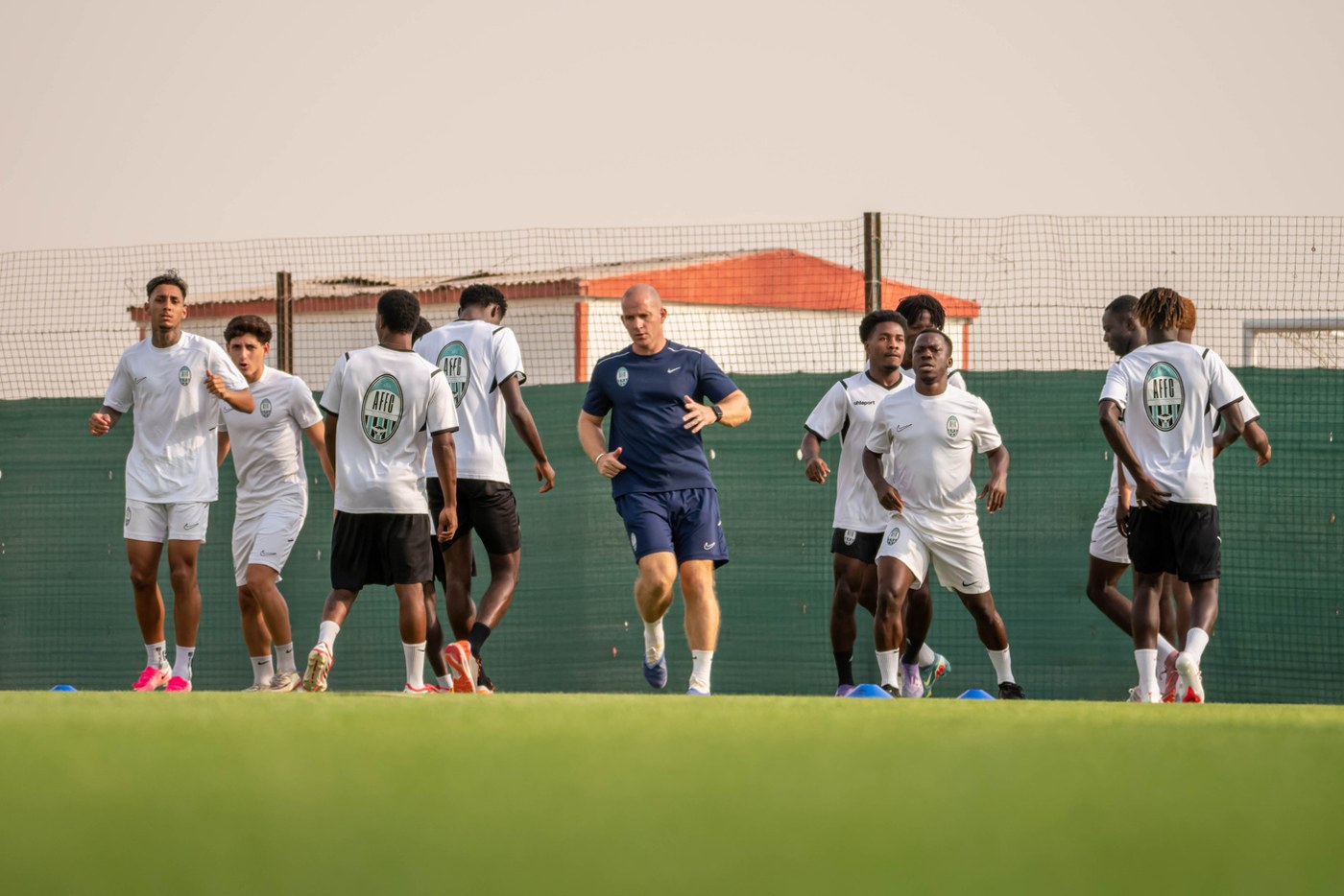 Arabian Falcons players and coaching staff during a training session